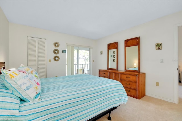 bedroom with light colored carpet and a closet