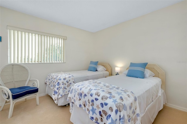 bedroom with light colored carpet