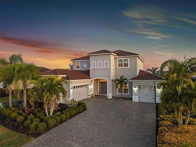 mediterranean / spanish-style home featuring a garage