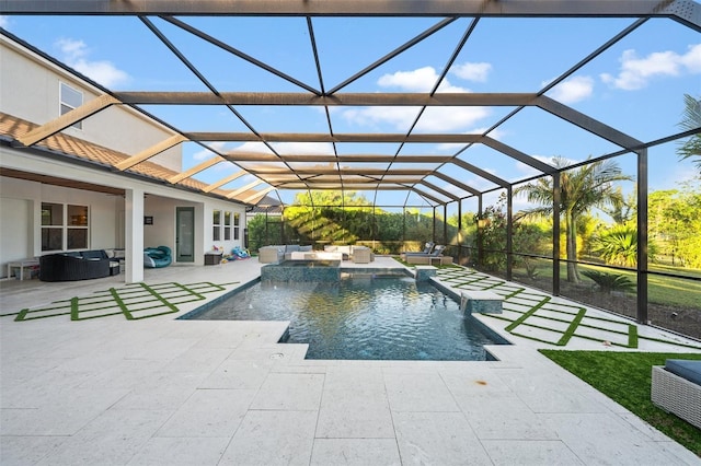 view of pool featuring a hot tub, a lanai, pool water feature, and a patio area