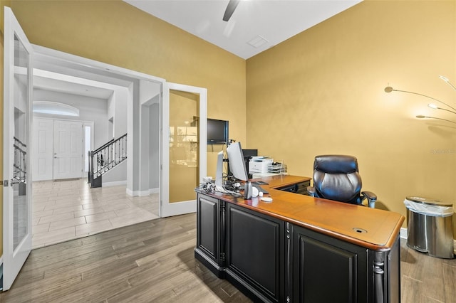 office featuring hardwood / wood-style flooring and french doors