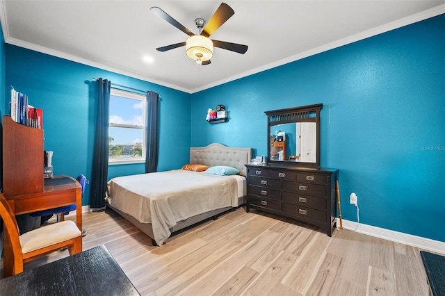 bedroom with crown molding, ceiling fan, and light wood-type flooring