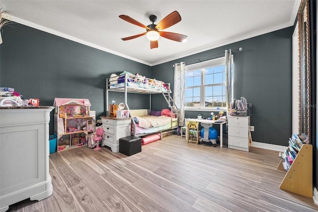 bedroom featuring crown molding, ceiling fan, and light wood-type flooring