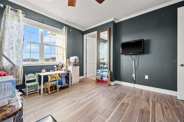 rec room with light hardwood / wood-style flooring, ornamental molding, and ceiling fan