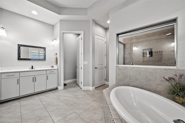 bathroom featuring tile patterned floors, vanity, and independent shower and bath