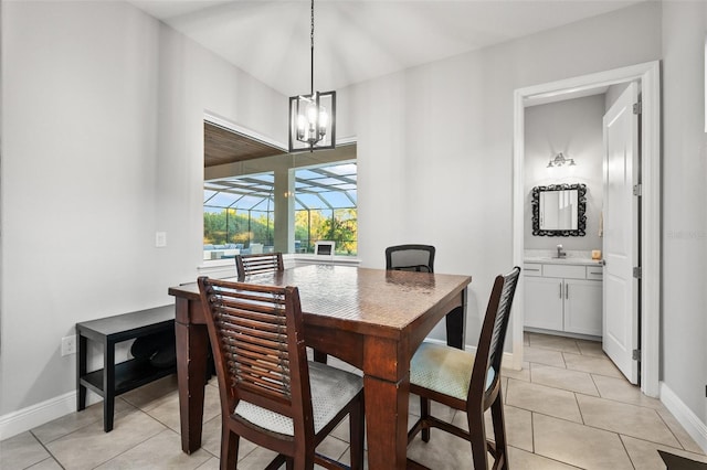 dining room featuring light tile patterned floors and sink