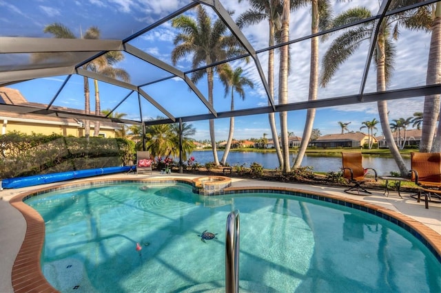 view of pool featuring a water view, a patio area, and glass enclosure