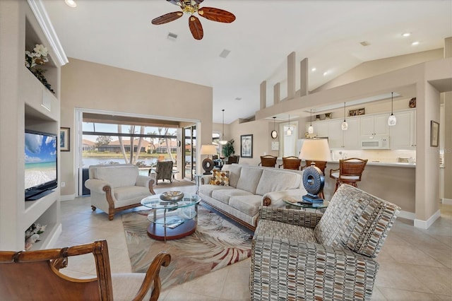 tiled living room featuring ceiling fan and high vaulted ceiling