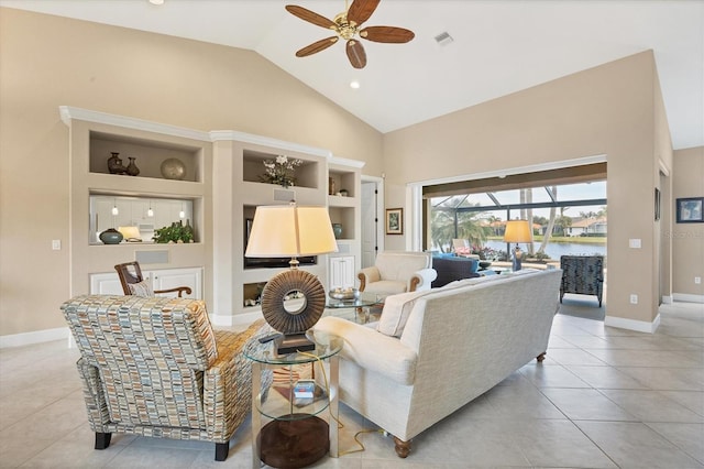 living room with built in features, ceiling fan, high vaulted ceiling, a water view, and light tile patterned flooring