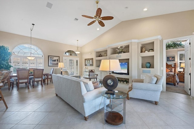 living room with light tile patterned floors, built in shelves, high vaulted ceiling, and ceiling fan