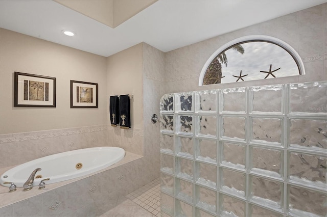 bathroom featuring tiled shower and tile patterned floors