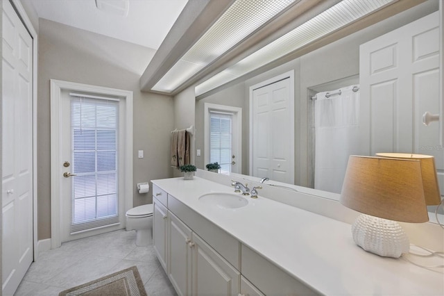 bathroom with tile patterned floors, vanity, toilet, and a shower with shower curtain