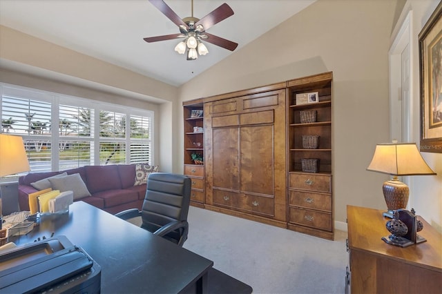 office area featuring vaulted ceiling, ceiling fan, and carpet