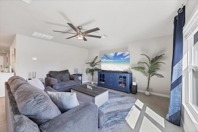 tiled living room with ceiling fan