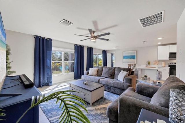 living room with ceiling fan