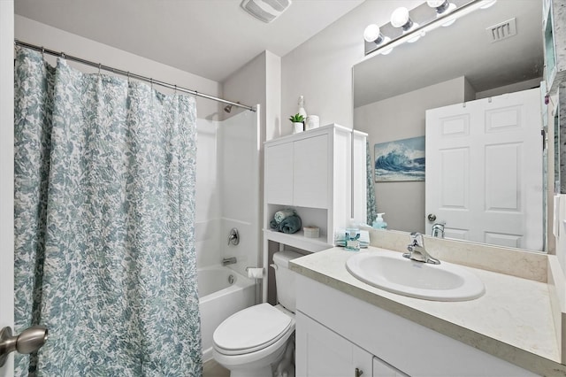 full bathroom featuring vanity, shower / bath combination with curtain, and toilet