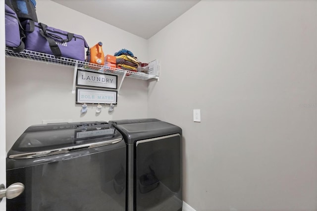 laundry area featuring washing machine and clothes dryer