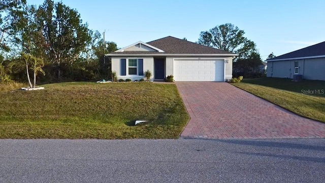 ranch-style house with a garage and a front lawn