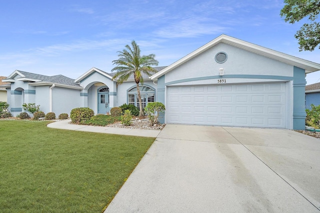 ranch-style house with a garage and a front yard