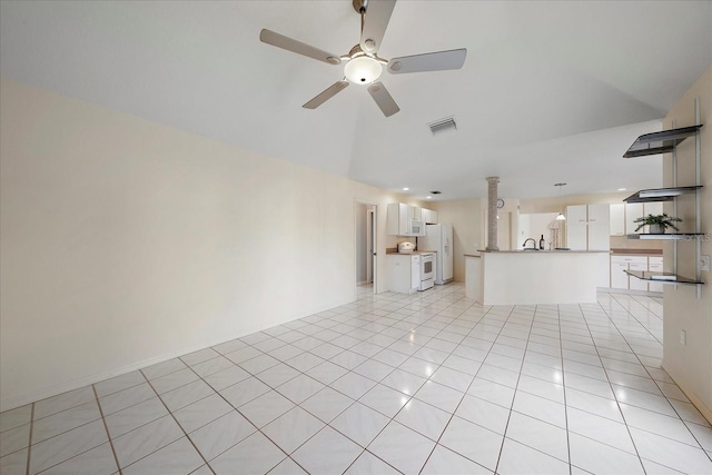 unfurnished living room with lofted ceiling, ceiling fan, and light tile patterned flooring