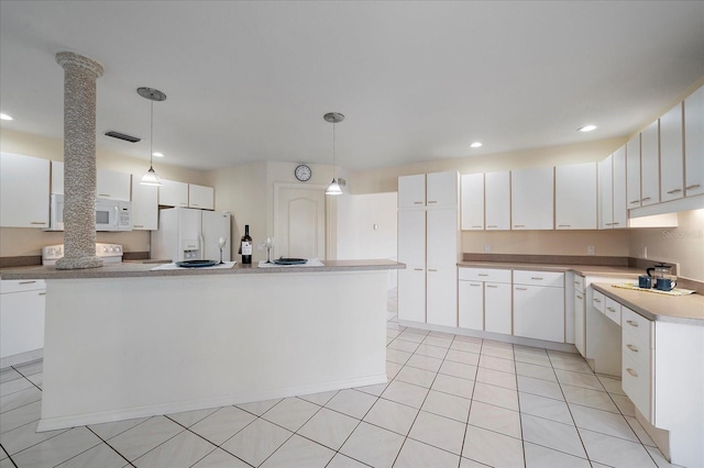 kitchen featuring white appliances, recessed lighting, hanging light fixtures, light countertops, and white cabinetry