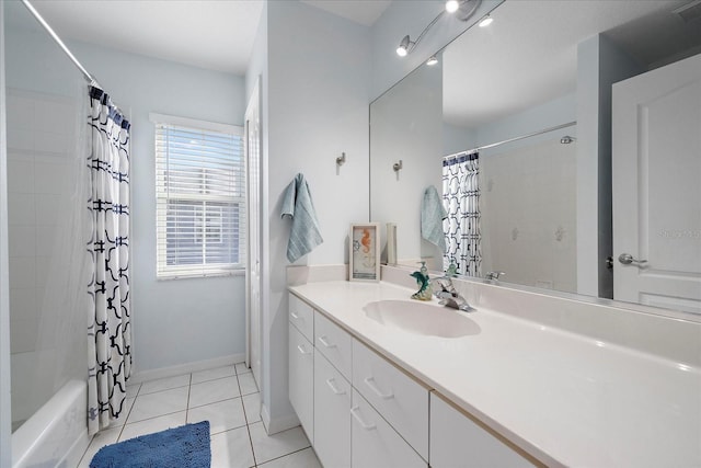 bathroom with vanity, tile patterned floors, shower / bath combo, and baseboards