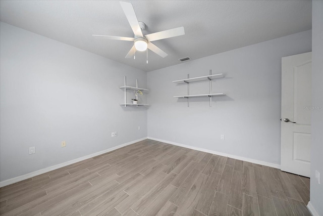 unfurnished room featuring ceiling fan and light hardwood / wood-style floors