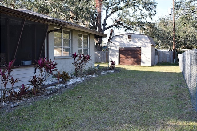 view of yard with an outbuilding and a garage