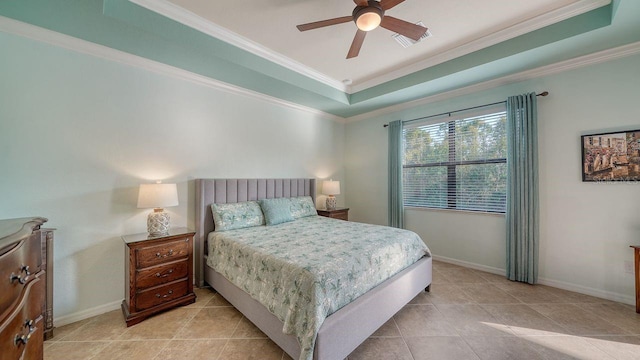 bedroom featuring crown molding, ceiling fan, a tray ceiling, and light tile patterned floors