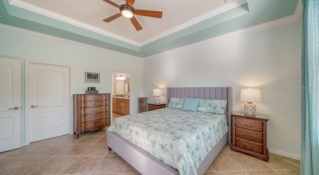 tiled bedroom featuring a raised ceiling, ornamental molding, connected bathroom, and ceiling fan