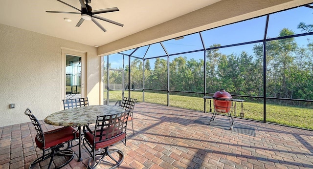 sunroom / solarium with ceiling fan