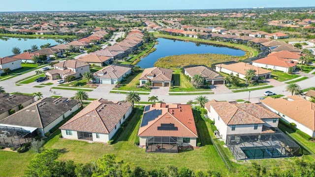 bird's eye view with a water view