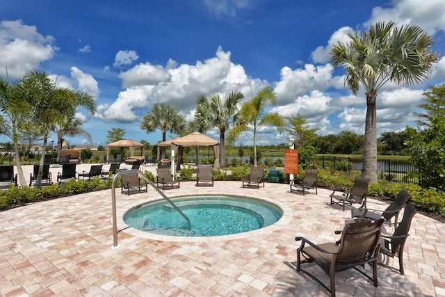 view of pool featuring a gazebo and a community hot tub