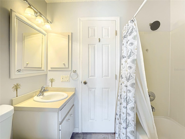 full bathroom featuring shower / tub combo, vanity, and toilet