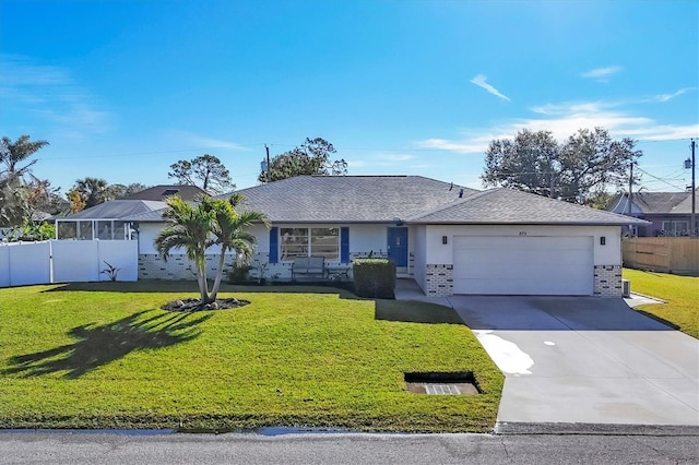 single story home featuring a garage and a front lawn