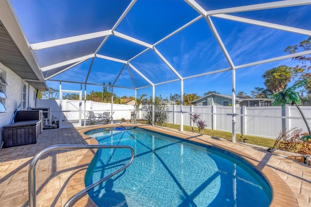 view of pool with a lanai and a patio