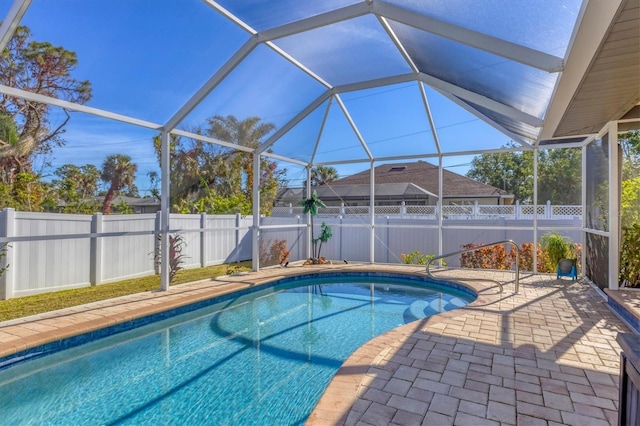 view of pool featuring a lanai and a patio area