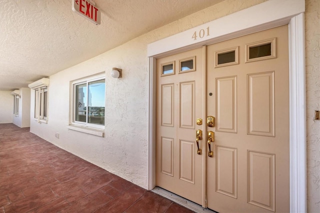 doorway to property with an AC wall unit