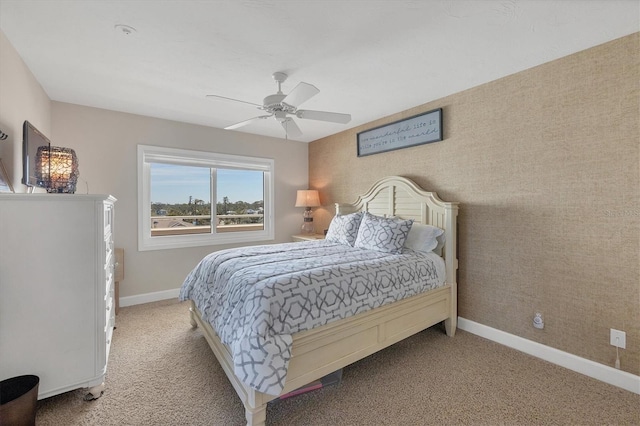 bedroom featuring light colored carpet and ceiling fan