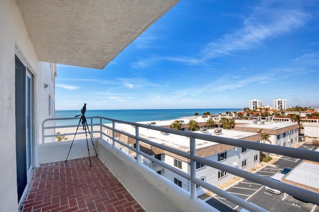 balcony with a view of the beach and a water view