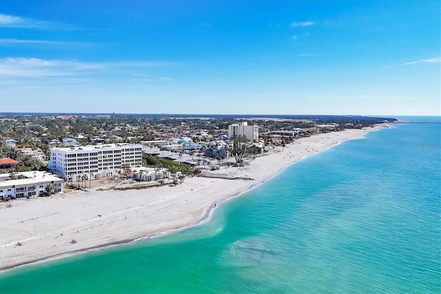 birds eye view of property with a beach view and a water view