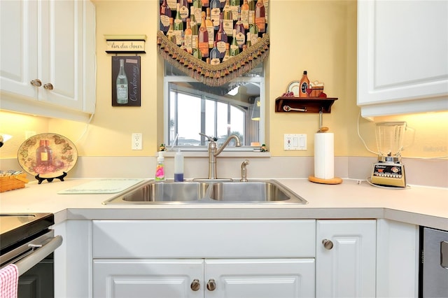 kitchen with sink and white cabinets