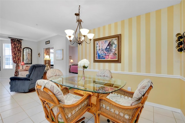 dining room with light tile patterned flooring and an inviting chandelier