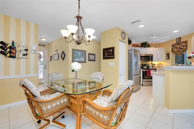 tiled dining space featuring ceiling fan