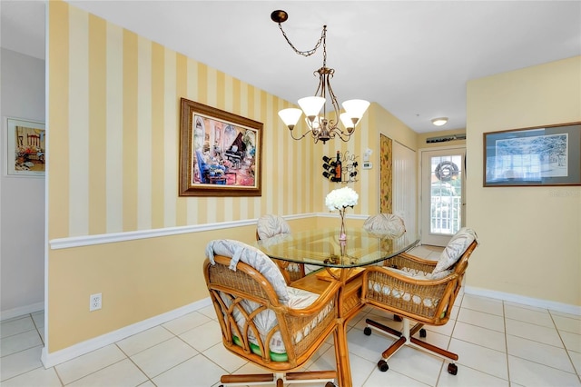 dining room with light tile patterned floors and a chandelier