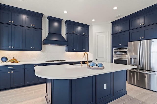 kitchen featuring stainless steel appliances, a kitchen island with sink, custom range hood, and backsplash