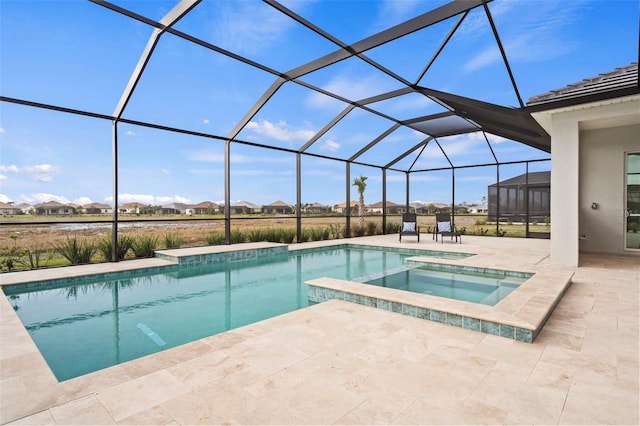 view of swimming pool featuring an in ground hot tub, a lanai, and a patio area