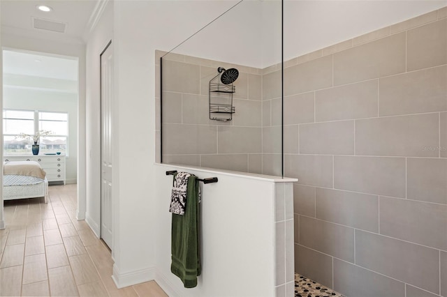 bathroom featuring tiled shower