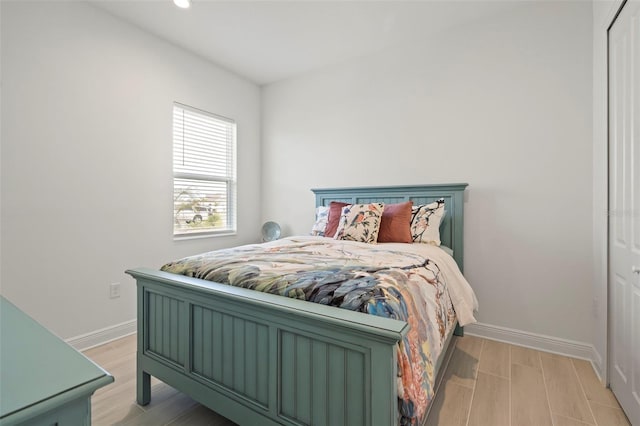 bedroom with light hardwood / wood-style floors