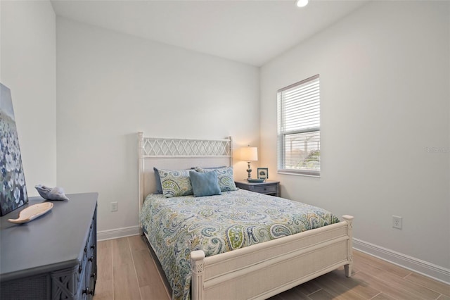 bedroom with light hardwood / wood-style flooring